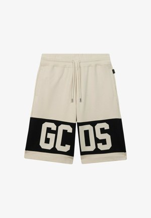 Beżowe szorty z czarnymi paskami przy brzegu, ozdobione dużymi beżowymi literami „GCDS”, z elastycznym pasem i sznurkiem do wiązania.