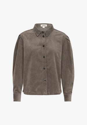 Kordfløjlsskjorte i dæmpet grå med knaplukning fortil, klassisk krave og lange ærmer. Har en subtil ribbet tekstur og sorte knapper.