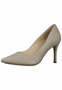 Pump in pelle beige con tacco alto, punta affusolata, texture liscia e tacco sottile di 7.5 cm. L'interno è di color chiaro.