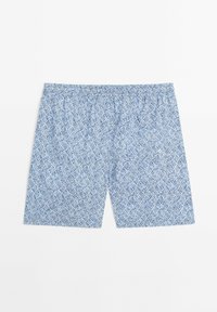Pantaloni corti blu a motivi con una cintura elastica. Il design presenta una stampa geometrica in diverse tonalità di blu. Tessuto leggero.