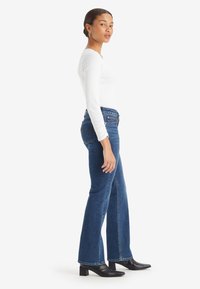 Levi's® SUPERLOW BOOTCUT - Bootcut-teksad - the last straw