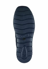 Schwarze Gummisohle mit strukturiertem Muster, das ein wellenförmiges Design und erhabene Kreise für besseren Halt aufweist. Markierungen umfassen "Hergestellt in Italien" und "Anti-Schock."