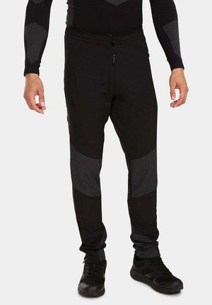 NUUK - Tracksuit bottoms - schwarz