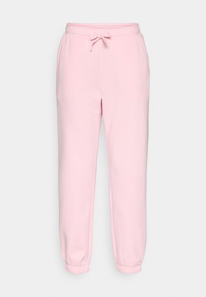 Jasnoróżowe bawełniane spodnie dresowe z elastycznym pasem i ściągaczami. Posiadają sznurek do ściągania i subtelne logo na lewym udzie.