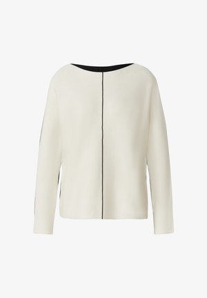 Cream-colored long-sleeve top with a black round neckline and a single thin black vertical line running down the center back.