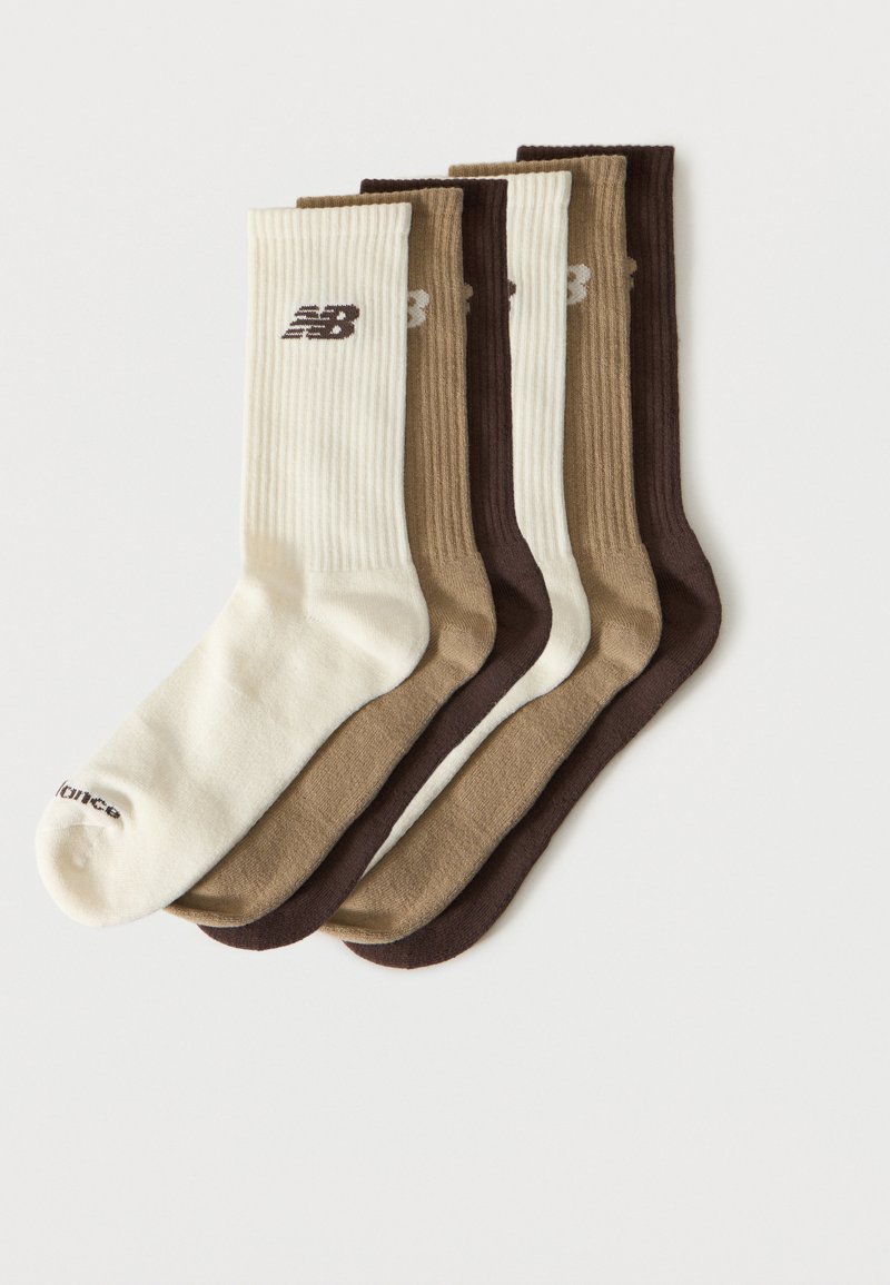 Cinq paires de chaussettes côtelées crème, beige et marron foncé, chacune avec un petit logo « NB » près du haut.