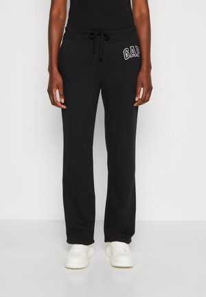 HERITAGE - Tracksuit bottoms - true black