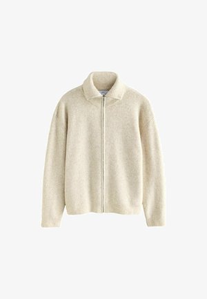 Krémový pletený kardigán s rebrovanou textúrou, vysokým golierom a predným zipsom. Obsahuje spadnuté ramená a dlhé rukávy, bez vzorov.