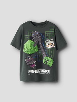 T-shirt gris foncé à thème Minecraft avec des personnages en blocs, dont un Enderman, un Creeper, un loup, et un motif de feuilles vertes sur un design en grille.