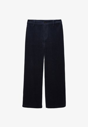 Pantalons en velours côtelé bleu marine à jambes larges avec une finition texturée, dotés d'une fermeture à bouton sur le devant et de poches, adaptés pour un usage décontracté.