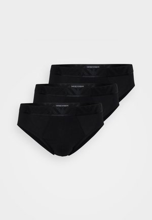 Tre paia di slip neri con un tessuto morbido, cinturino elastico con logo in rilievo e un design aderente.