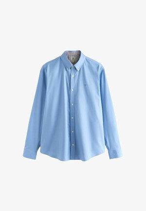 Camicetta azzurra chiara in cotone, con colletto classico, maniche lunghe e motivo a quadratini all'interno del colletto.