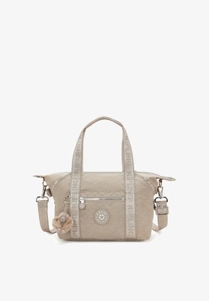 Beige Kipling handbag with dual handles, adjustable strap, front zip pocket, brand logo, and plush monkey keychain.