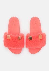 Coral slide sandals with a fluffy fur upper, featuring metallic accents resembling ears. Soft, textured footbed for comfort.