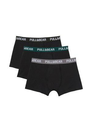 Trois boxers noirs pour hommes avec des ceintures élastiques en noir, vert et gris, chacun marqué du texte "PULL&BEAR".