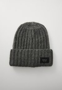 Gray knit beanie with a ribbed texture and a folded cuff. Features a black fabric label with white text on the front.