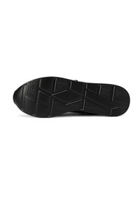 Suola di sneaker nera con una superficie in gomma testurizzata, caratterizzata da un motivo a spina di pesce e accenti geometrici per aderenza e stabilità.