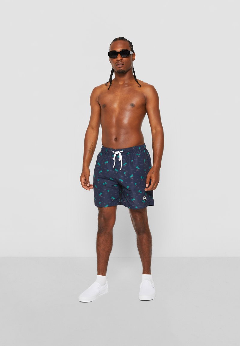 Urban Classics - Short de bain motif/style Bloc - Noir Rouge - Homme - 21.99