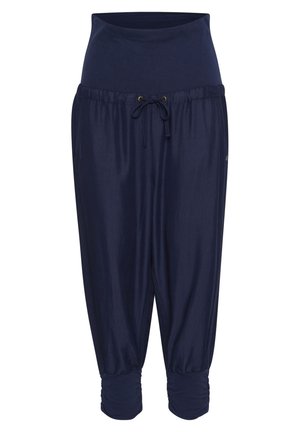 Pantalon de grossesse bleu marine avec large ceinture élastique, cordon de serrage ajustable, coupe ample et poignets froncés aux chevilles.