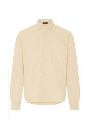 Camicia beige in corduroy a maniche lunghe con bottoni frontali, taschino sul petto, colletto appuntito e piccolo etichetta in tessuto sul bordo della tasca.