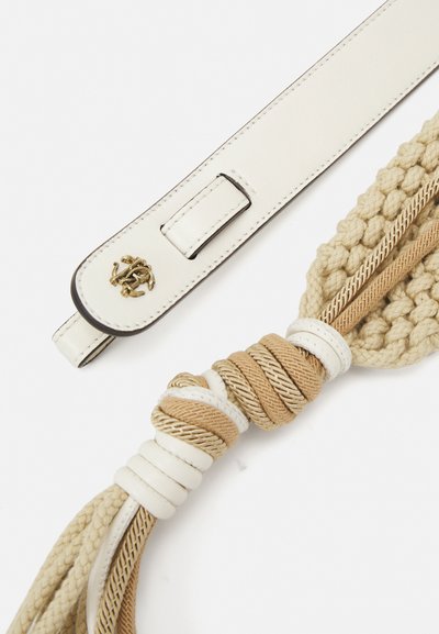 White leather strap with a gold logo, featuring a textured beige woven section with twisted rope details and smooth accents.