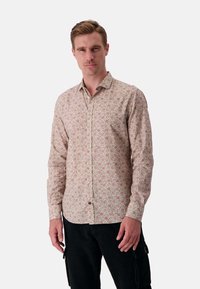 Camicia a maniche lunghe con bottoni di colore rosa chiaro e piccolo motivo floreale. Presenta un colletto classico e un orlo curvo. Realizzata in tessuto leggero.