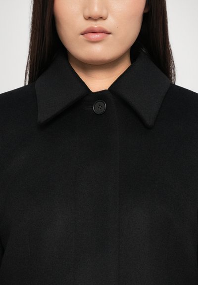 Black wool coat with a large collar and a single button closure. Soft texture with a smooth, uniform finish and minimal detailing.