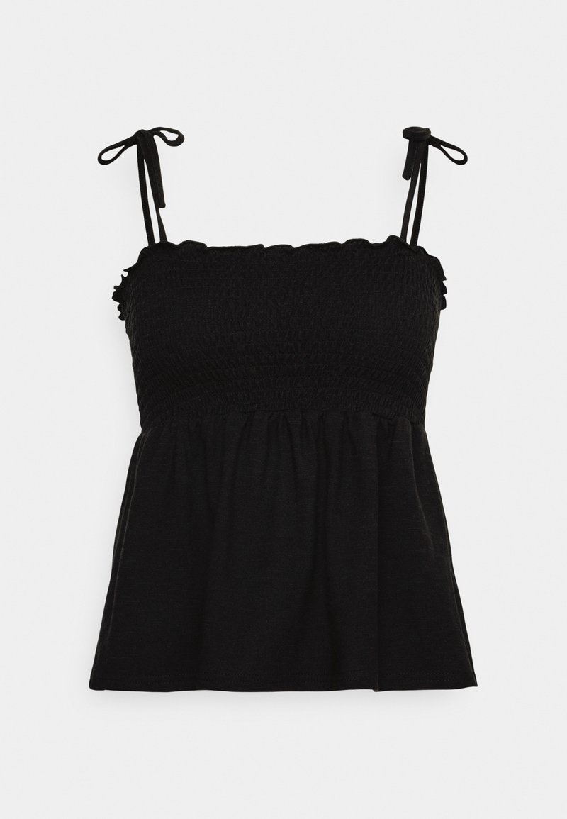 Haut noir sans manches avec corsage smocké, col à volants et bretelles à nouer sur un fond blanc uni.