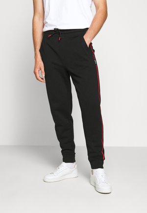 DOAKY - Tracksuit bottoms - black