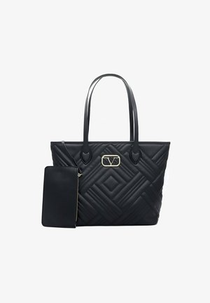 Black quilted tote bag with dual handles, featuring a gold-tone logo accent. Includes a detachable matching pouch. Smooth texture throughout.