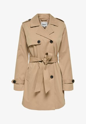 Trench-coat beige à double boutonnage avec des boutons noirs, une taille ceinturée, des épaulettes et des bracelets aux poignets.