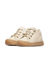 Scarpe per bambini di colore beige chiaro con cerniera laterale, lacci nella parte anteriore, cuciture decorative e suole in gomma su uno sfondo bianco.