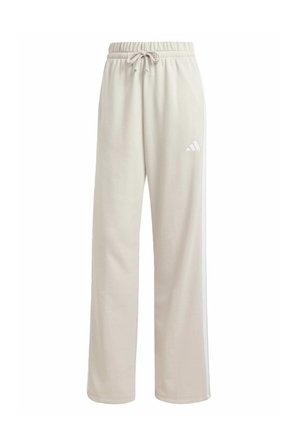 Beige cotton sweatpants with an elastic waistband, drawstring, white side stripes, and a small white logo on the left thigh.