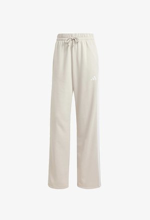 Beige cotton sweatpants with an elastic waistband, drawstring, white side stripes, and a small white logo on the left thigh.