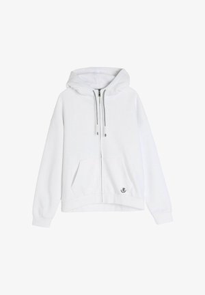 Biała bluza z kapturem zapinana na zamek z dużym kapturem, przednią kieszenią, ściągaczami przy mankietach i dolnym brzegu oraz małym graficznym logo na dolnym prawym rogu.