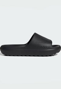 Black slide sandals made of textured synthetic material, featuring a wide strap and a thick, contoured sole with wave-like tread. Logo displayed.