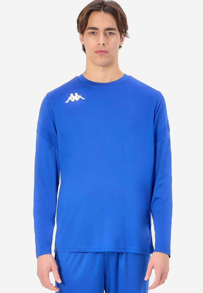 Blå långärmad träningsskjorta i slät tyg, med rund halsringning och en vit logotyp på vänster axel.