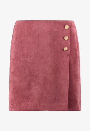 Jupe mini en velours côtelé rose poudré avec trois boutons dorés sur le côté gauche. Caractérisée par une texture côtelée verticale et un design portefeuille.