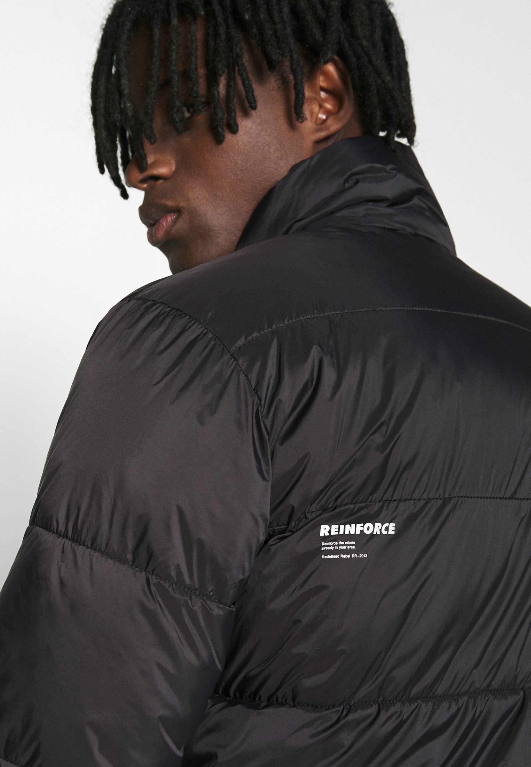 solid black windbreaker