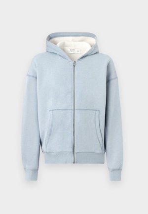 Light blue zip-up hoodie with front pockets and a hood, displayed on a plain white background.