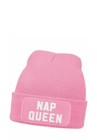Pink knit beanie with a cuff, featuring a white rectangular patch that reads "NAP QUEEN" in bold capital letters. Textured ribbed material.