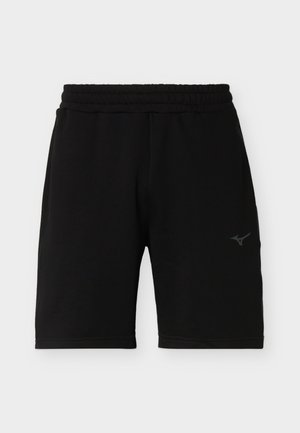 Shorts de sport noirs avec ceinture élastique et petit logo réfléchissant Mizuno sur la cuisse droite, présentés sur un fond clair uni.
