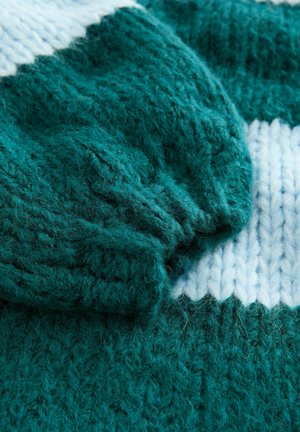Teal knitted sweater featuring a ribbed cuff and a contrasting white stripe pattern. Soft texture with loose, fluffy yarn details.