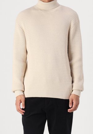 Stickad tröja - beige