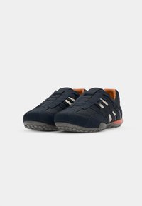 Blue and gray athletic shoes with mesh design, rubber sole, and three white stripes on each side. Orange interior lining for comfort.