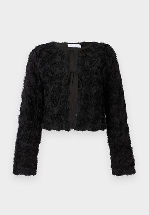 Giacca nera corta con design floreale testurizzato, dotata di maniche lunghe e chiusura anteriore con lacci, realizzata in morbido tessuto.