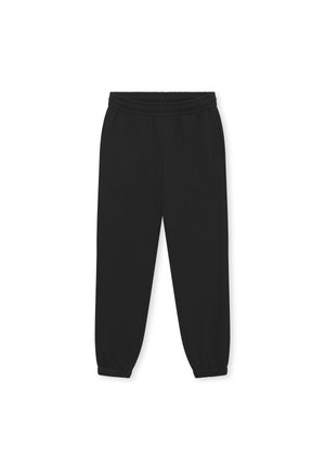Zwarte joggingbroeken van zacht materiaal, met een elastische tailleband, afgewerkte enkels en twee zijzakken. Eenvoudig, gestroomlijnd ontwerp.