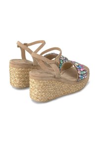 Beige wedge sandals with multiple adjustable straps, embellished with colorful gems on the upper and jute-wrapped platform.