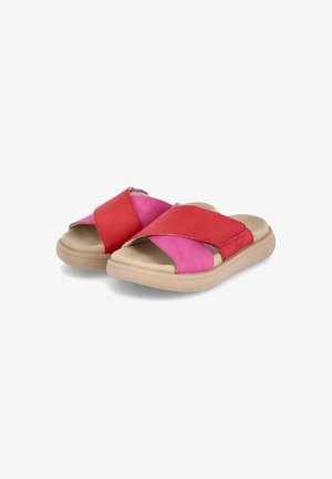 Red and pink slide sandals featuring a cross-strap design. Made of smooth leather and suede with a textured beige rubber sole.