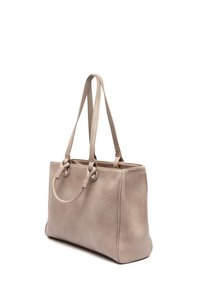 Beige läder tote väska med dubbla handtag, strukturerad form och texturerad yta. Har runda metallaccentser på handtagsfästen.